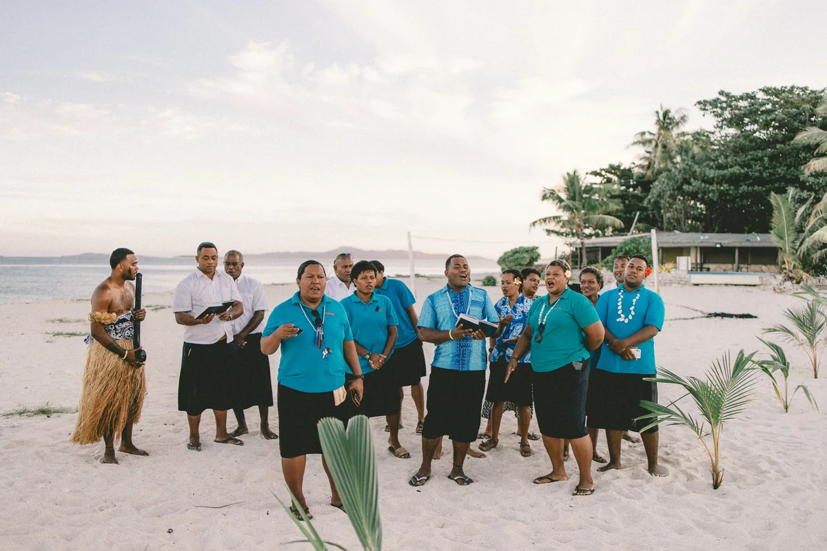 A group of Fijians singing together on a beach near Nadi, Fiji